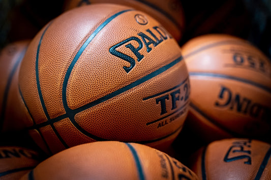 A pile of basketballs sitting on top of each other