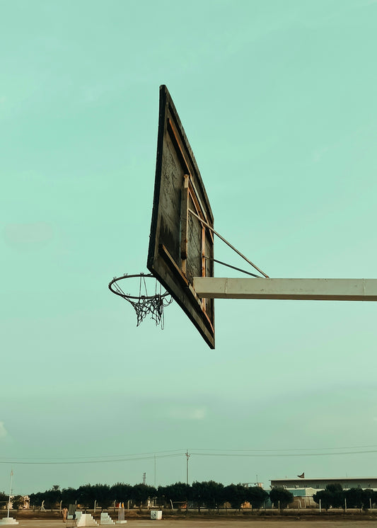 a basketball hoop with a basketball going through it