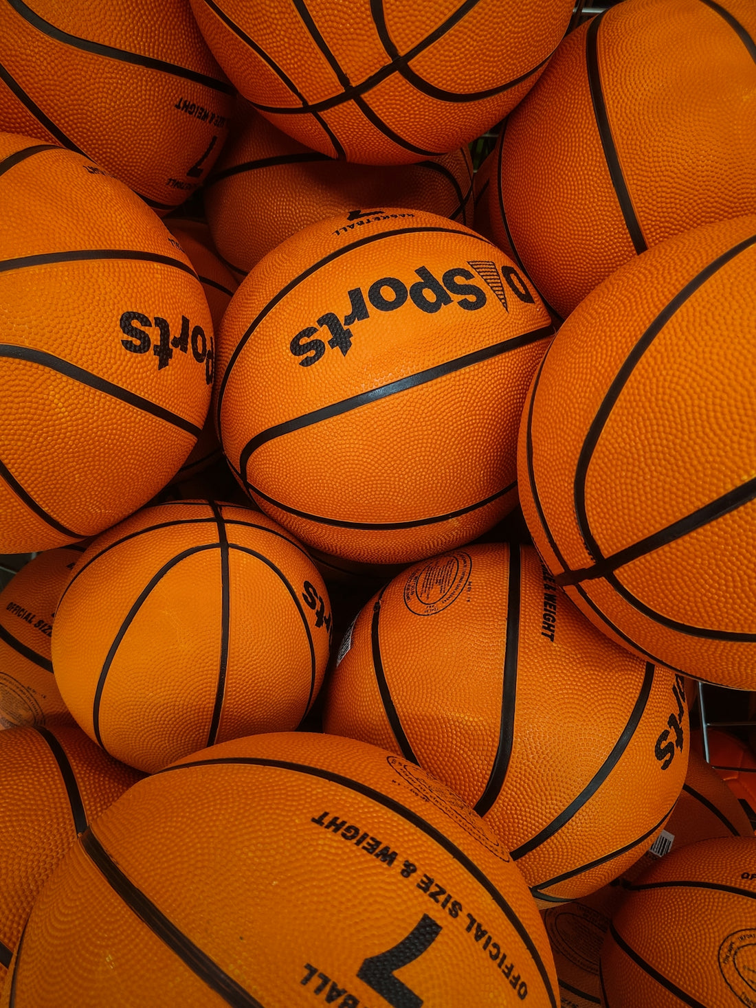 a pile of basketballs sitting on top of each other