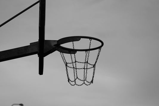 a black and white photo of a basketball hoop