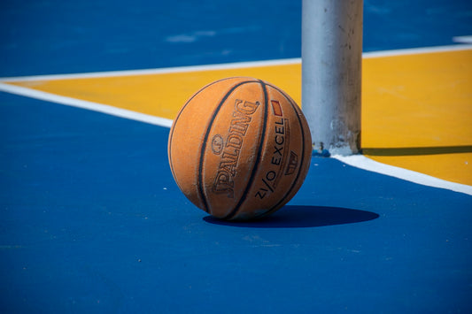 a close up of a basketball on a court