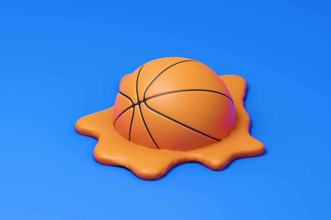 A basketball melting into a pool of liquid.