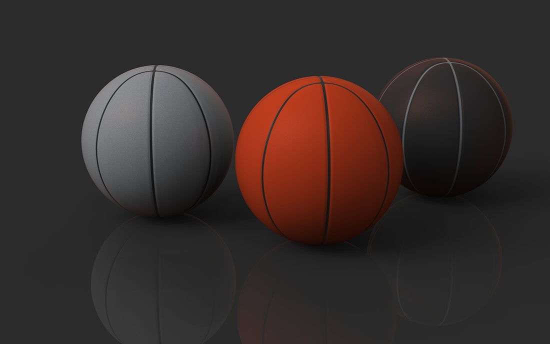 Three basketballs in different colors.